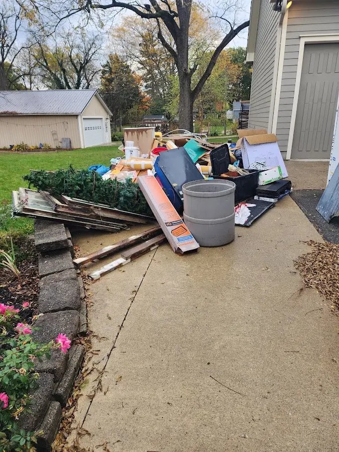 Dumpster being loaded with debris for 3 Yard Dumpster Rental in Cold Spring